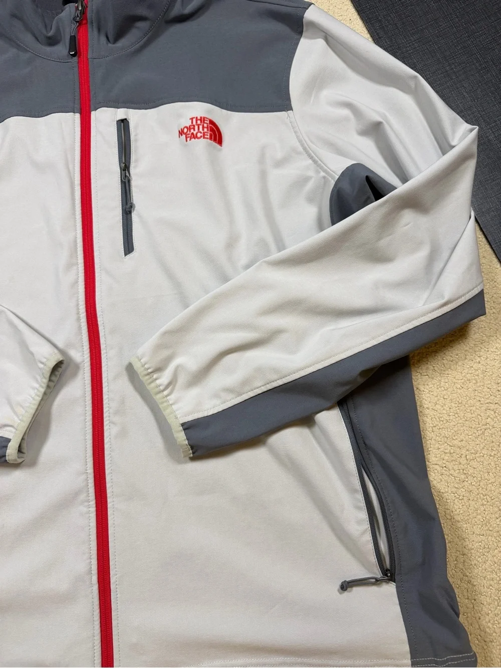 The North Face Men’s Gray Jacket with Red Zipper